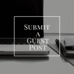 A laptop on a desk with notebooks and papers beside it. A white square frame overlay contains the text "Submit a Guest Post". The background is blurred, ensuring the text stands out prominently.