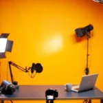 professional podcast and vlogging setup in studio with yellow wall