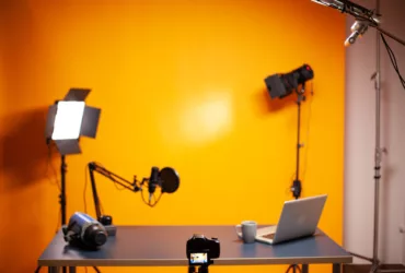professional podcast and vlogging setup in studio with yellow wall