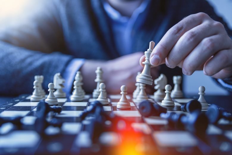 depth of field photography of man playing chess, Effective Business Administration