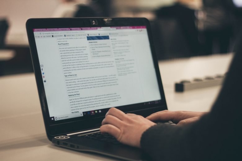 person typing on laptop computer, content marketing