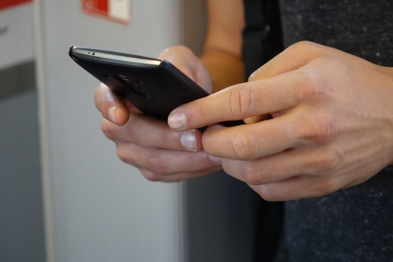 smartphone, hands, tap, How to Receive SMS without a Phone Using Virtual Numbers