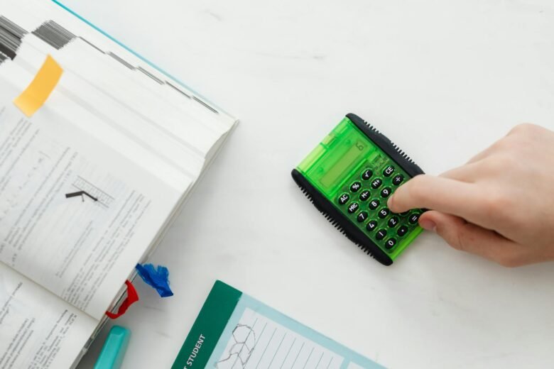 Person Using A Green and Black Calculator, Free AI Math Solver