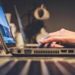 person using silver laptop computer on desk, online gambling, Online Togel Sites