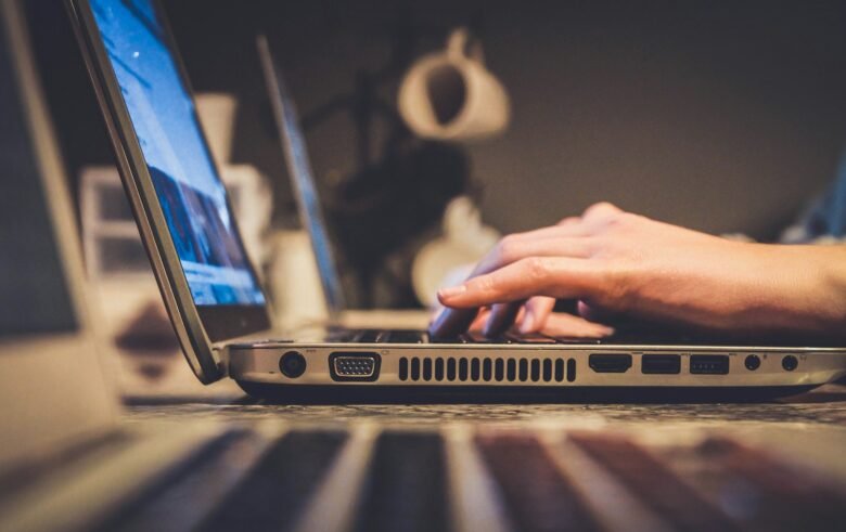 person using silver laptop computer on desk, online gambling, Online Togel Sites