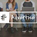 Four young adults sit in a row, using various devices like smartphones and a laptop. An overlay text reads "#Advertise," implying a focus on digital media or marketing. They are casually dressed and seated against a plain wall with a wooden floor.
