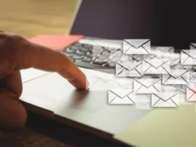 hand tounching laptop and many envelopes, Best Email Marketing Courses For Business