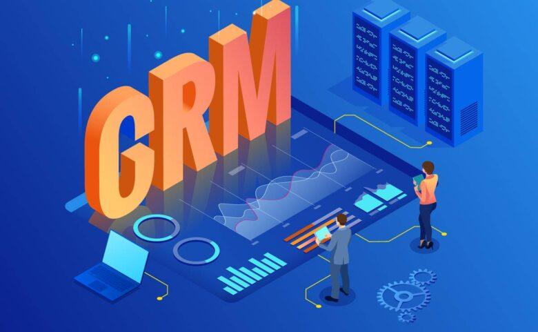 A vibrant illustration shows two people interacting with a large digital interface featuring graphs and charts. The central focus is the giant text "CRM," surrounded by technology icons, a laptop, and server towers on a blue background, indicating data analysis and customer relationship management.
