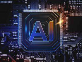 A glowing microchip with the letters "AI" in the center is embedded in an intricate circuit board pattern, symbolizing artificial intelligence. The background features various electronic components and a dark, futuristic design with blue and yellow lighting accents.