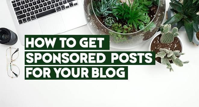 Image showing a white desk with a laptop, eyeglasses, a camera lens, and various potted plants, including succulents and cacti. The text on the image reads "HOW TO GET SPONSORED POSTS FOR YOUR BLOG" in bold green lettering.