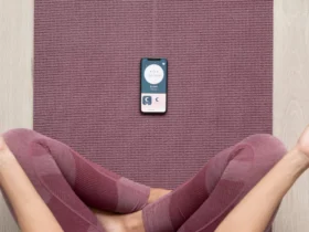fitness woman doing yoga with a mobile Meditation app