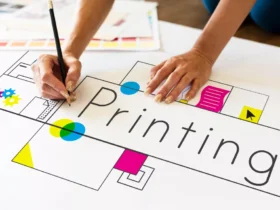 hands working on network graphic overlay banner on desk printing services