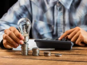 man cunting the stack of coins