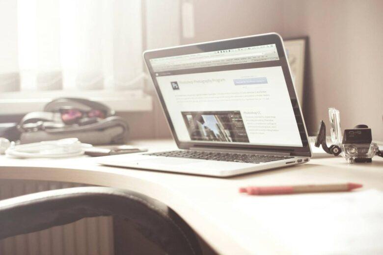 Black and Gray Laptop Computer on Writing Desk, Register to Indian Oil