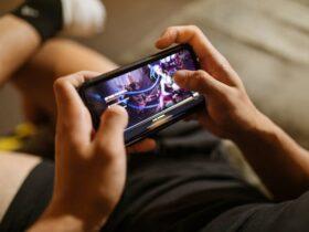 man playing mobile gaming