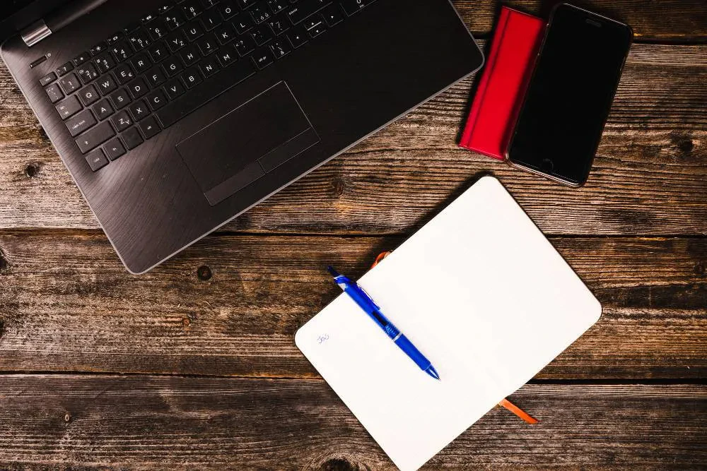 notebook with a pen