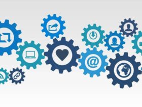 Graphic of interlocking gears with various technology and communication icons, including a heart, world, email, power button, and user profiles, symbolizing interconnected digital interactions.