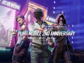 Three characters from PUBG Mobile stand in front of a futuristic backdrop with neon lights. Text reads "PUBG Mobile 2nd Anniversary" at the center.