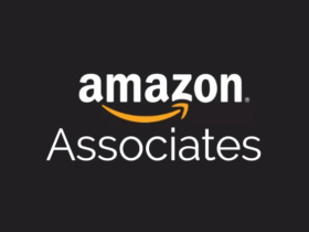 The image displays the Amazon Associates logo. The word "amazon" is written in lowercase with a yellow arrow underneath it, extending from the letter "a" to "z". Below this, the word "Associates" is written in smaller, white text on a dark background.