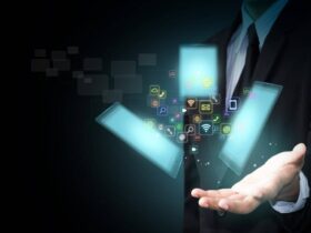 A person in a suit holds a glowing digital hologram displaying various app icons and symbols, with three transparent rectangles hovering above their hand.