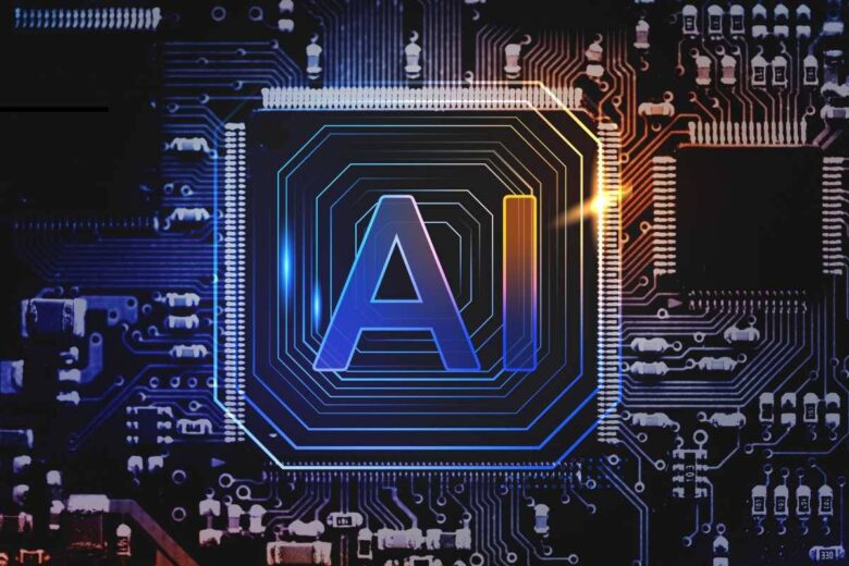 A glowing microchip with the letters "AI" in the center is embedded in an intricate circuit board pattern, symbolizing artificial intelligence. The background features various electronic components and a dark, futuristic design with blue and yellow lighting accents.
