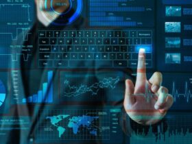 A person interacts with a futuristic touchscreen interface displaying various financial charts, graphs, and data visualizations. They are pressing a key on a virtual keyboard, surrounded by technological and financial graphics including a world map and pie charts.