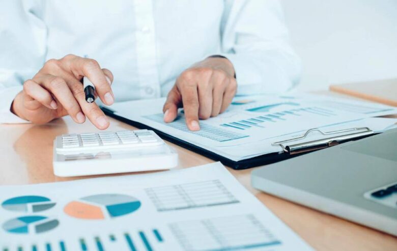 man calculating tax claims for business losses