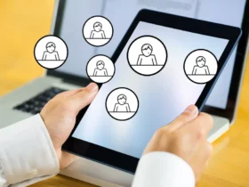 hands holding a tablet with icons relate to employee engagement platform
