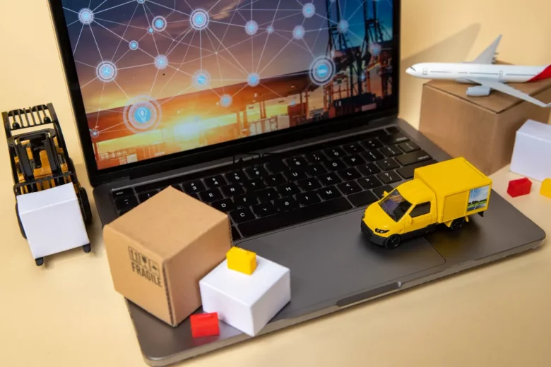 vehicles on laptop supply chain representation Outsourcing logistic