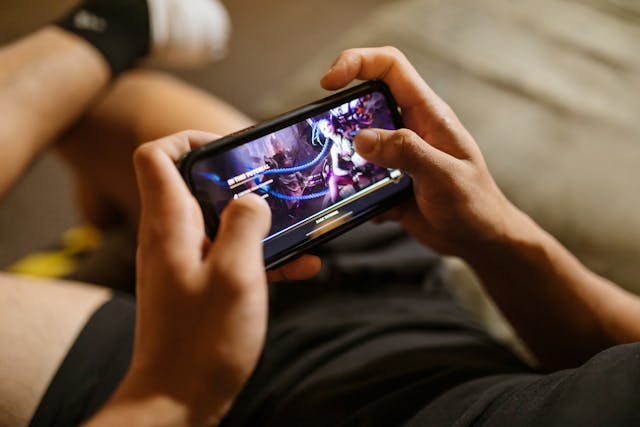 man playing mobile gaming